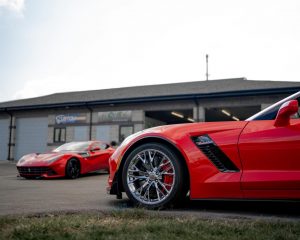 Red Corvette and Ferrari outside EcoShine Detailing in Maumee Ohio